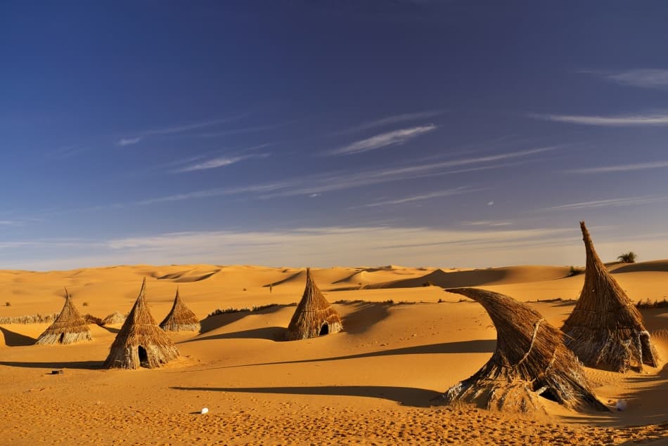Desert Huts Under Blue Sky by Ivan Slosar — canvas wall art