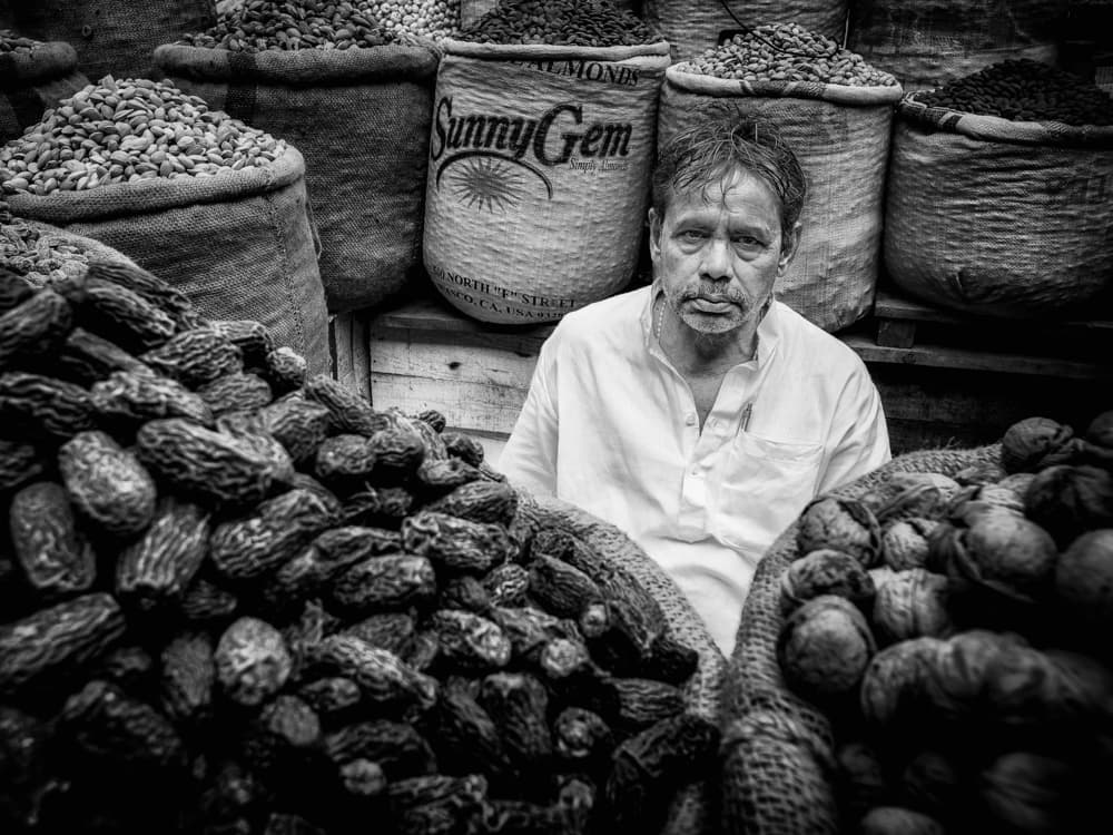 Pensive Market Vendor by Pavol Stranak — canvas wall art