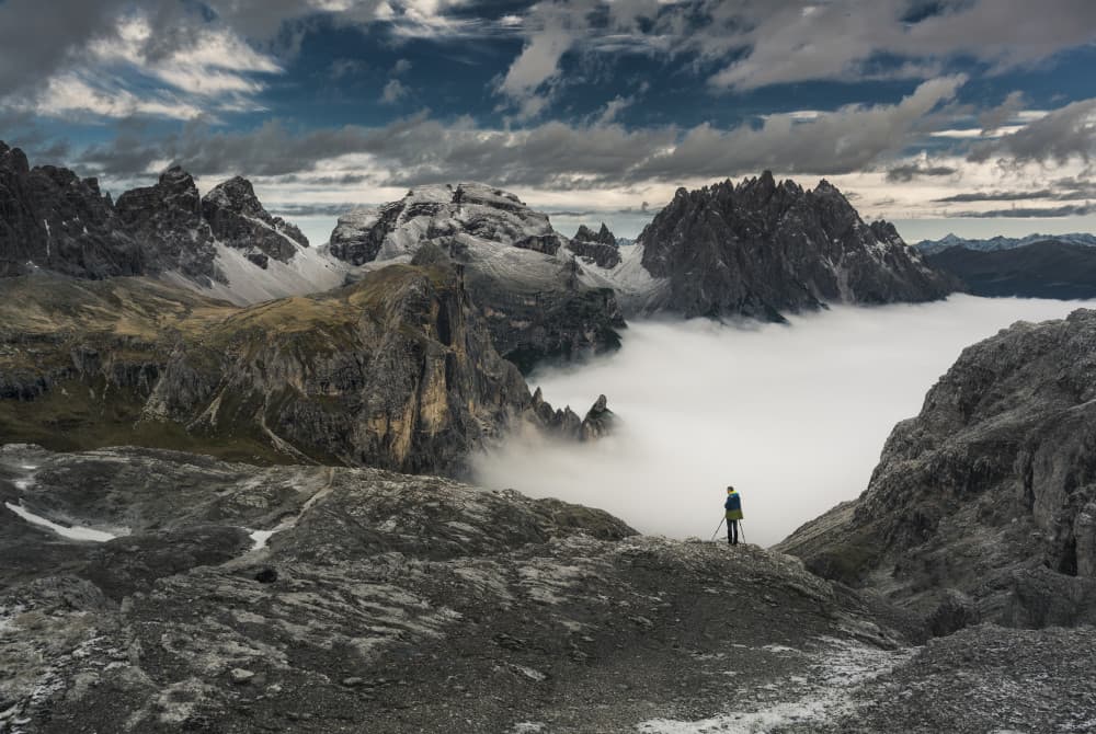 Alpine Hiker Above Clouds by Karol Nienartowicz — canvas wall art