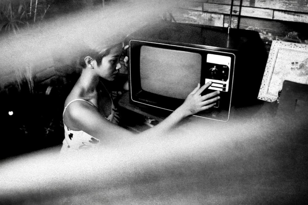 Woman Adjusting Vintage TV by Abr Abe — canvas wall art