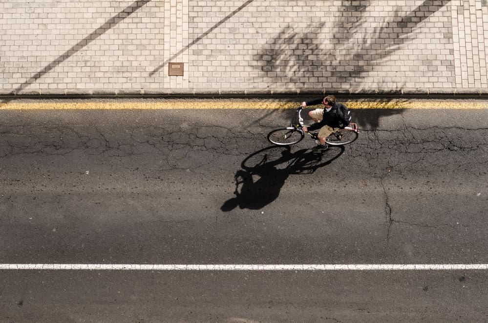 City Cycling Shadow by Piera Polo — canvas wall art