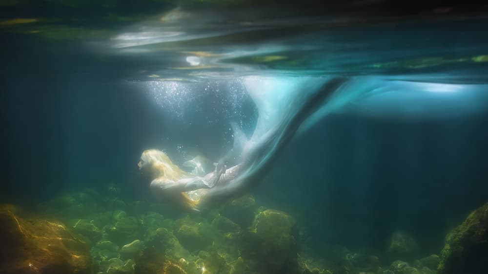 Ethereal Underwater Swimmer by Paolo Lazzarotti — canvas wall art