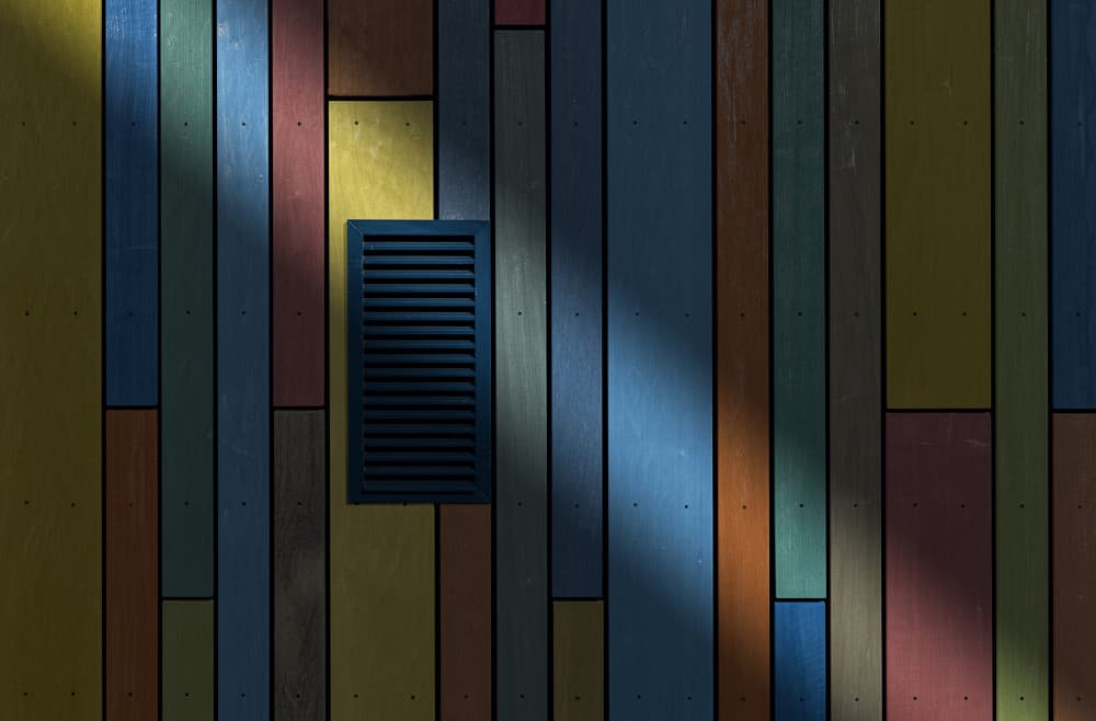 Shadows On Colorful Wood by Wim Schuurmans — canvas wall art