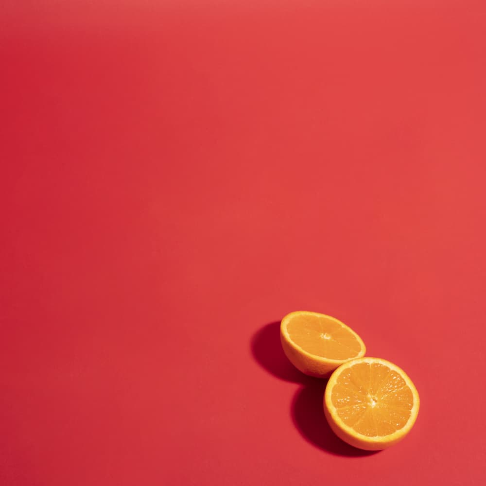 Bright Orange Halves by Julia Ramiro — canvas wall art
