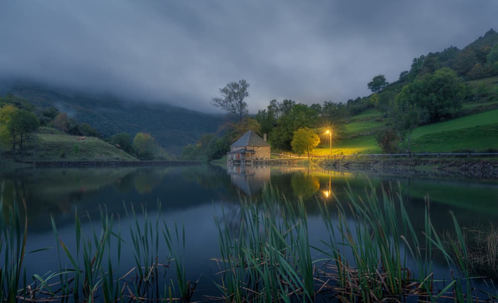 Misty Lake House Glow by Carlos Hernandez Martinez — canvas wall art
