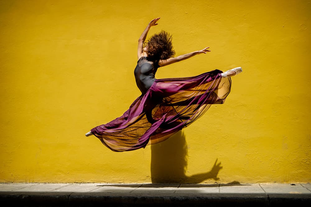 Yellow Wall Ballet Leap by Joan Gil Raga — canvas wall art
