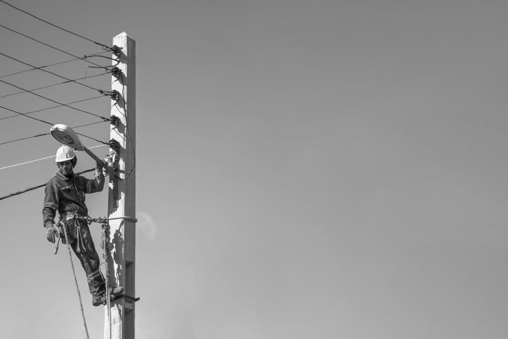Man Installing Streetlight by Arastoo Qadermazi — canvas wall art
