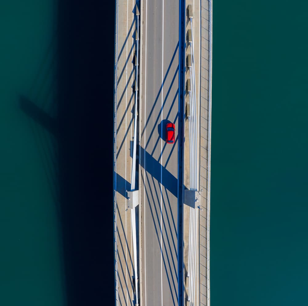 Aerial Bridge Red Car by Jure Kravanja — canvas wall art