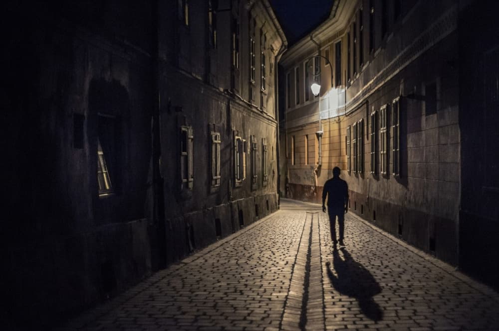 Man Walking Dark Street by Dan-Stefan Susa — canvas wall art