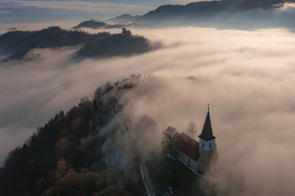 Church Above the Fog by Jure Kravanja — canvas wall art