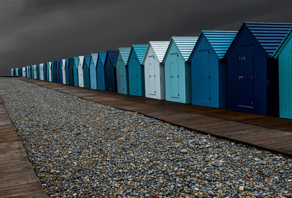 Coastal Blue Huts by Eric Mattheyses — canvas wall art