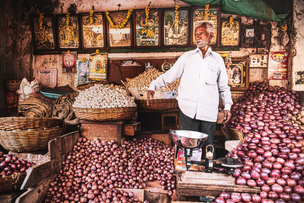 Indian Market Vendor by Marco Tagliarino — canvas wall art