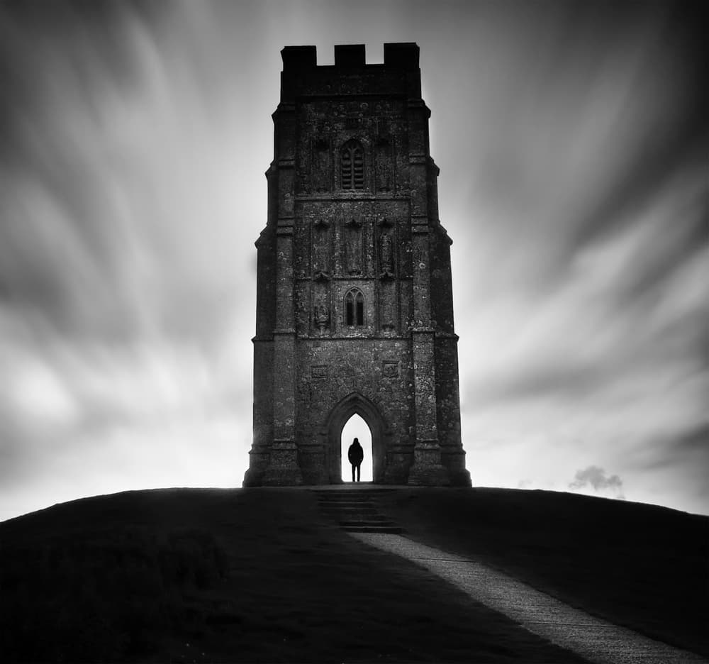 Lone Figure Ancient Tower by Catalin Alexandru — canvas wall art