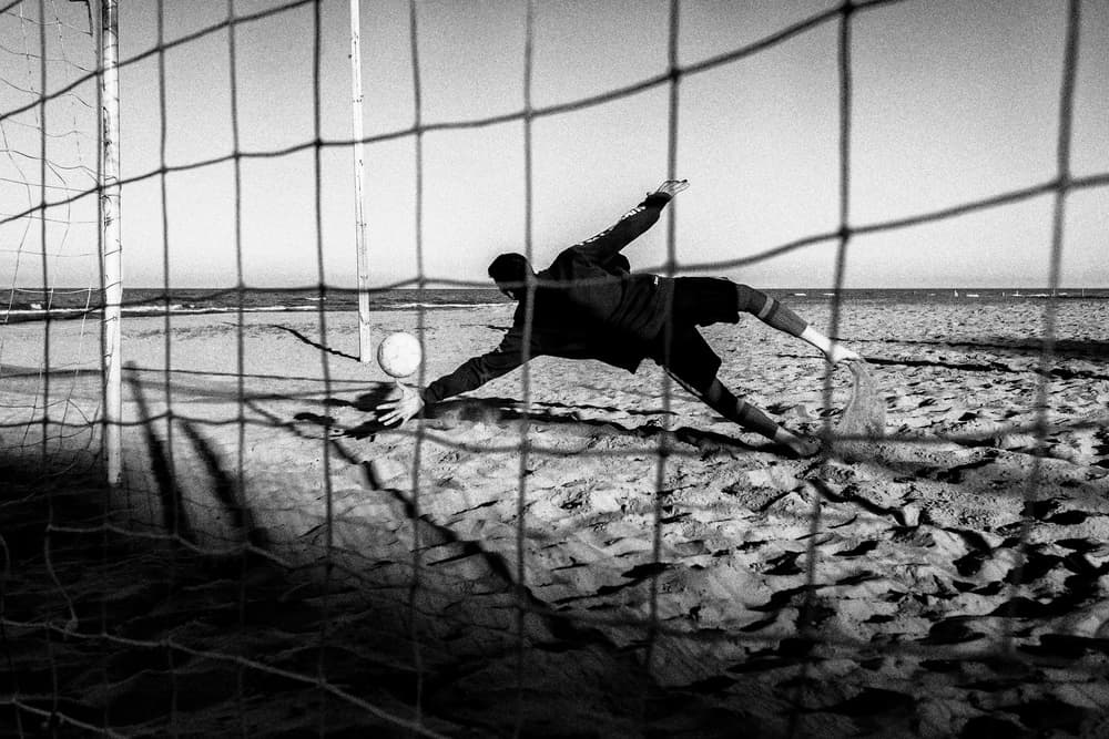 Goalkeeper Saves on Beach by Riccardo Lucidi — canvas wall art