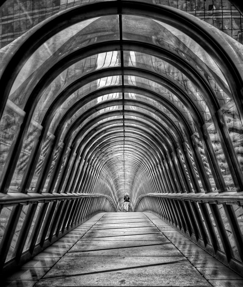 Lone Figure Arched Bridge by Frank Bruynseraede — canvas wall art