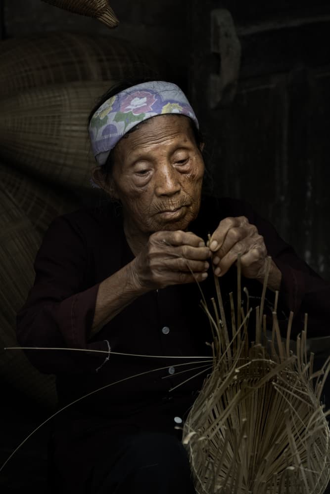 Elderly Craftswoman Weaving by Jack Ou — canvas wall art