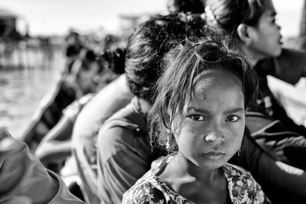 Young Girl's Candid Gaze by Kieron Long — canvas wall art