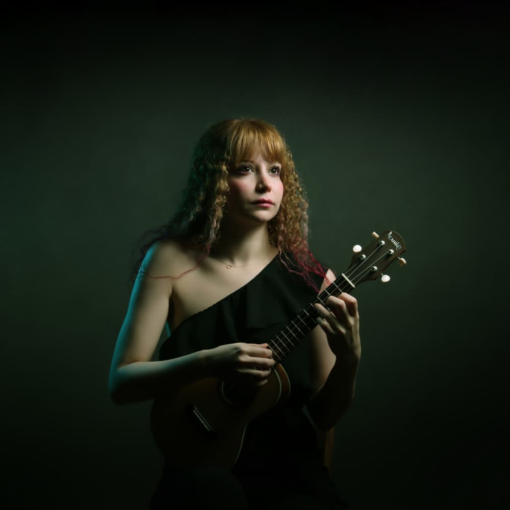 Thoughtful Ukulele Player by Moein Hasheminasab — canvas wall art