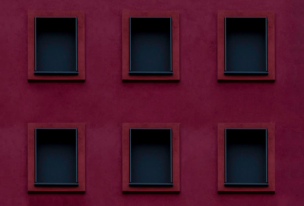 Red Wall Dark Windows by Sascha Block — canvas wall art