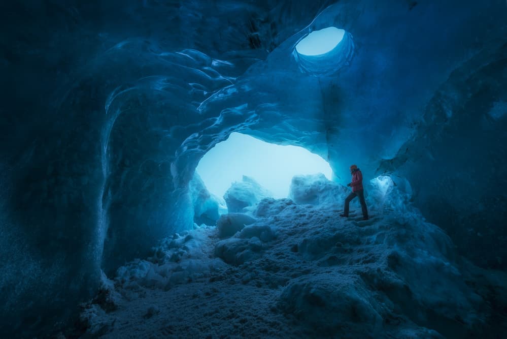 Exploring Blue Ice Cave by David Martin Castan — canvas wall art