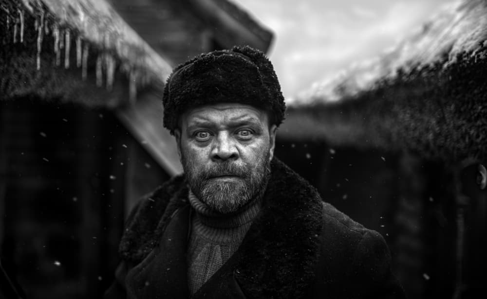 Winter Man's Intense Gaze by Waldemar Szmidt — canvas wall art