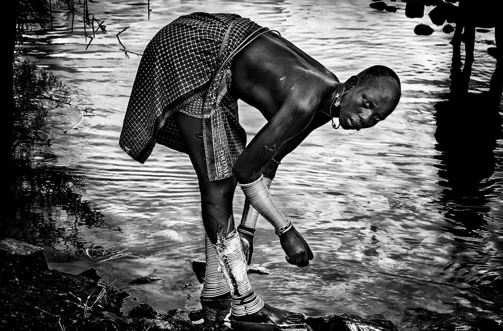 Traditional Man By Water by Joxe Inazio Kuesta Garmendia — canvas wall art
