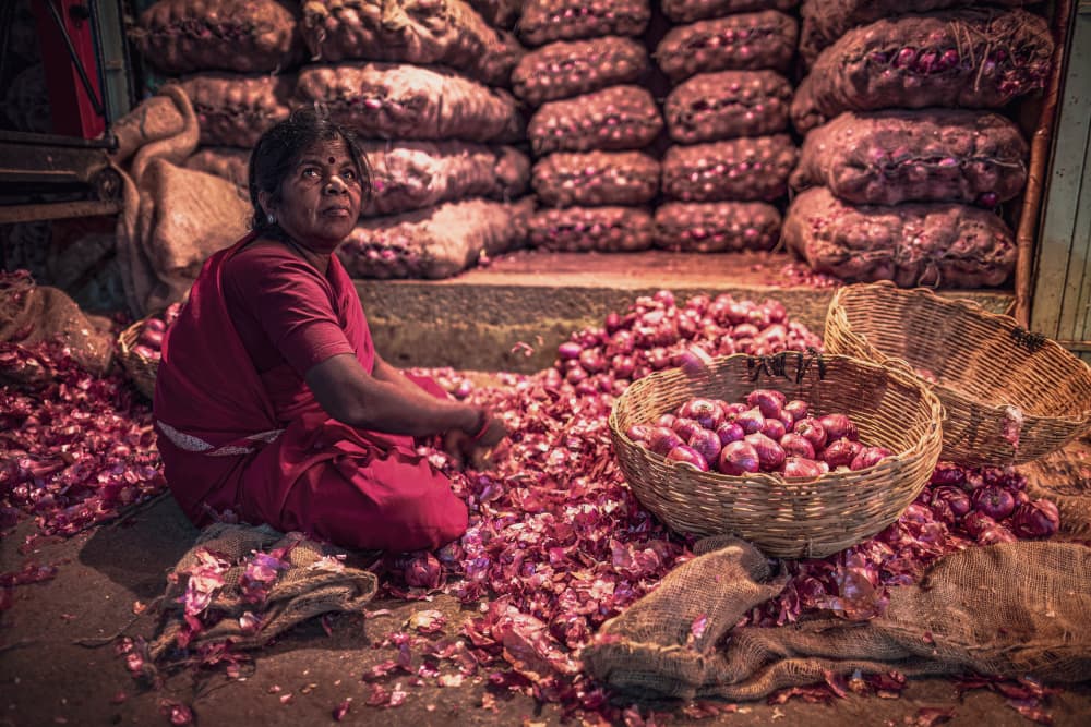 Market Woman With Onions by Marco Tagliarino — canvas wall art