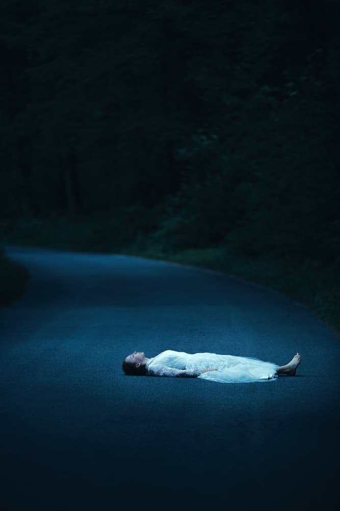 Woman on Dark Road by Magdalena Russocka — canvas wall art