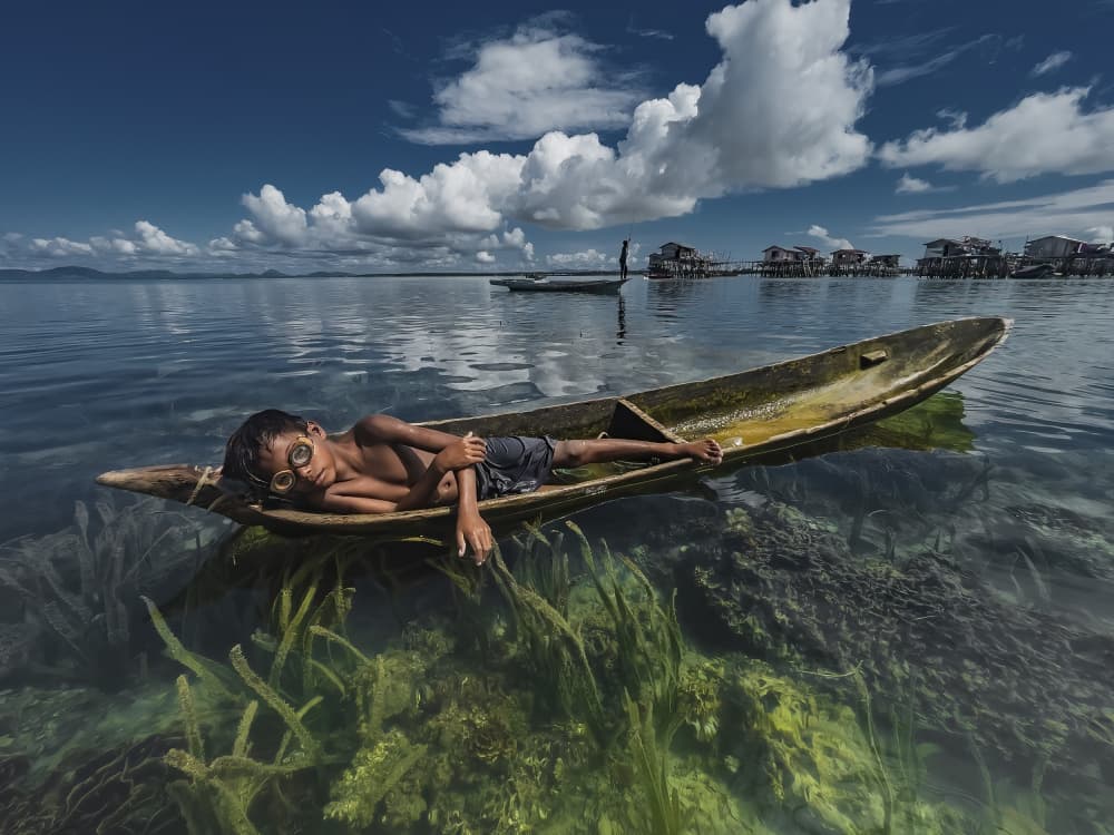 Boy Floating In Clear Water by Muslianshah Masrie — canvas wall art