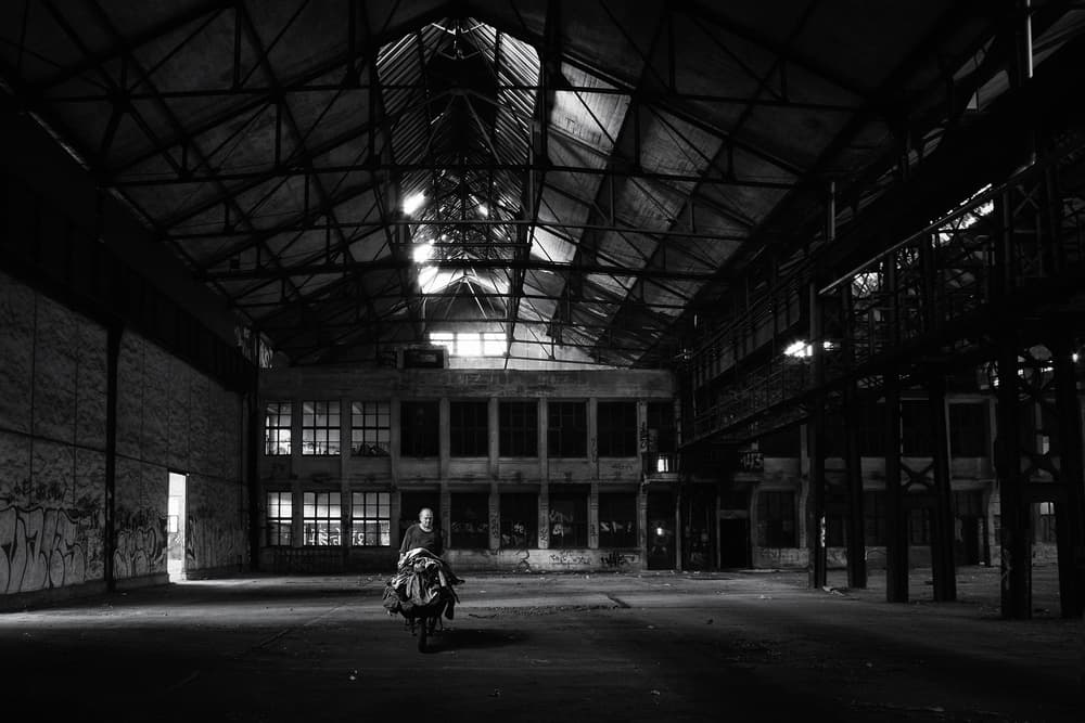 Lone Figure in Warehouse by Holger Droste — canvas wall art