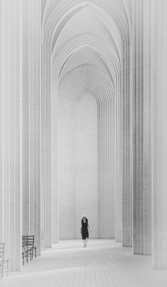Woman Under White Arches by Louie Luo — canvas wall art