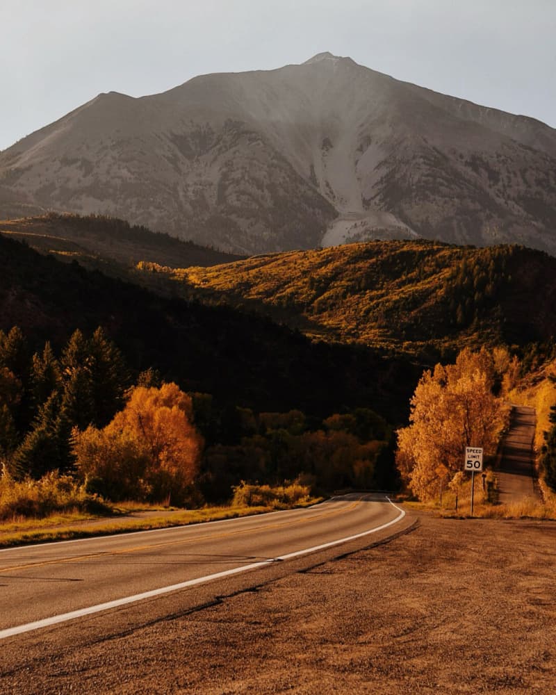 Golden Autumn Mountain Road by Del Mundo Imagery — canvas wall art