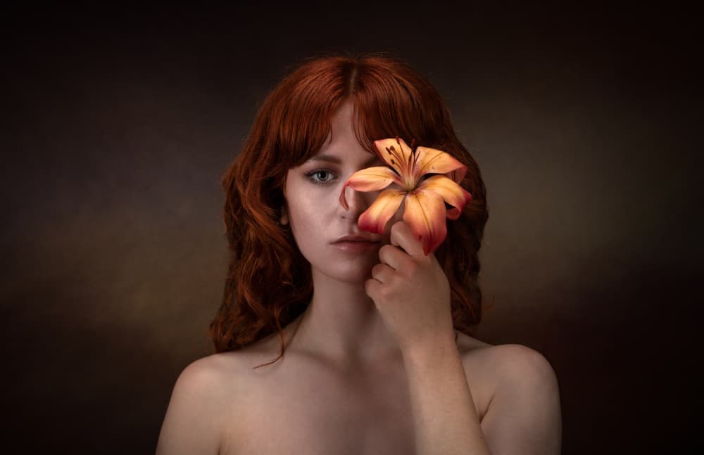 Mysterious Redhead With Lily by Luc Stalmans — canvas wall art