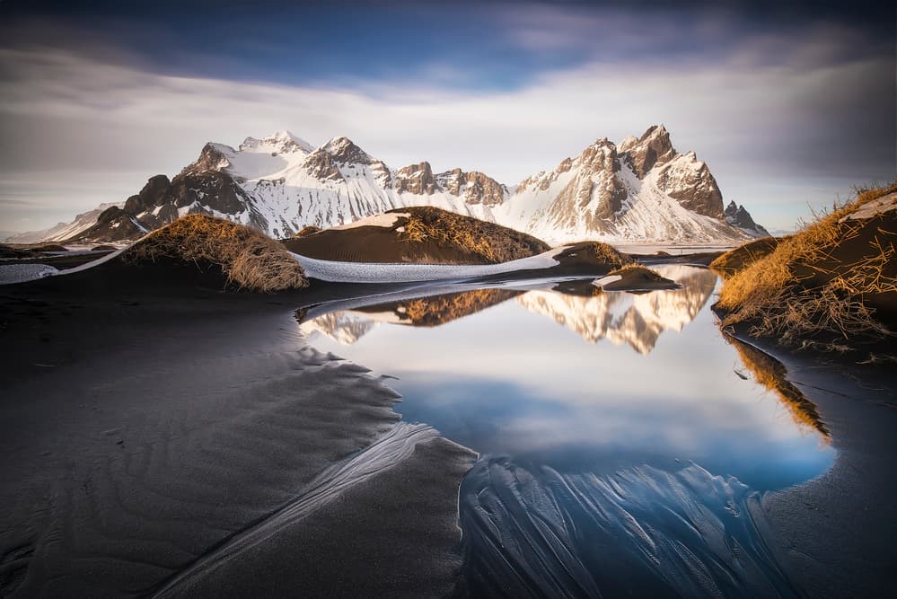 Snowy Peaks Reflection by Nicola Molteni — canvas wall art