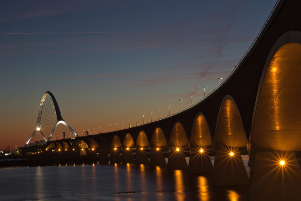 Twilight Bridge Glow by Anne Ponsen — canvas wall art