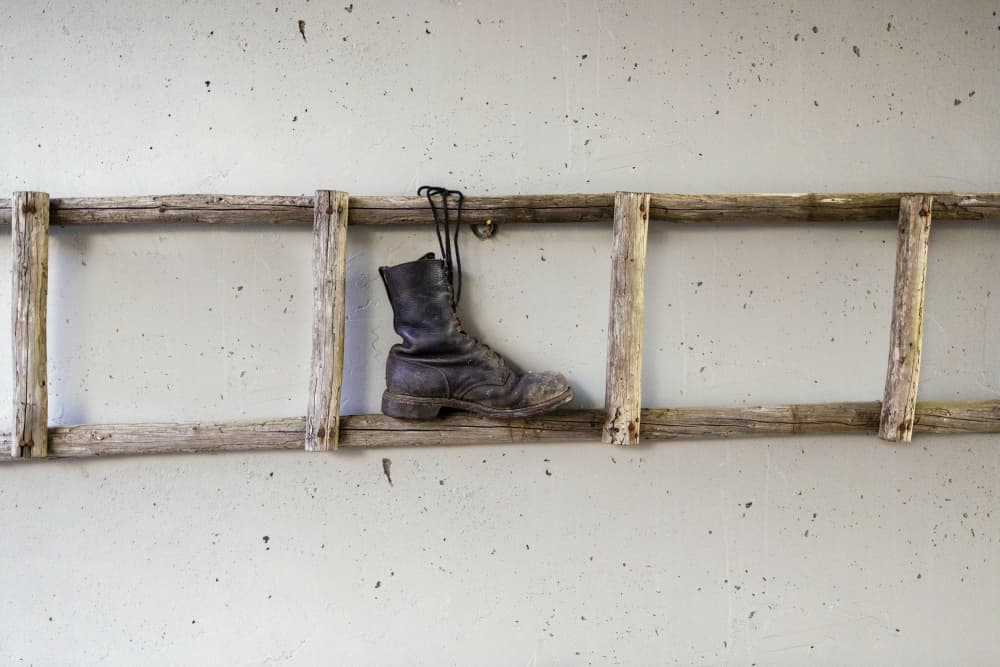 Rustic Boot On Ladder by Normunds Kaprano — canvas wall art