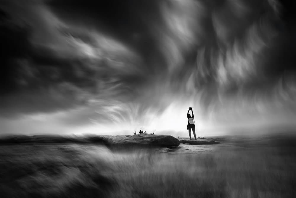 Woman Under Dramatic Sky by Shan Jiang — canvas wall art