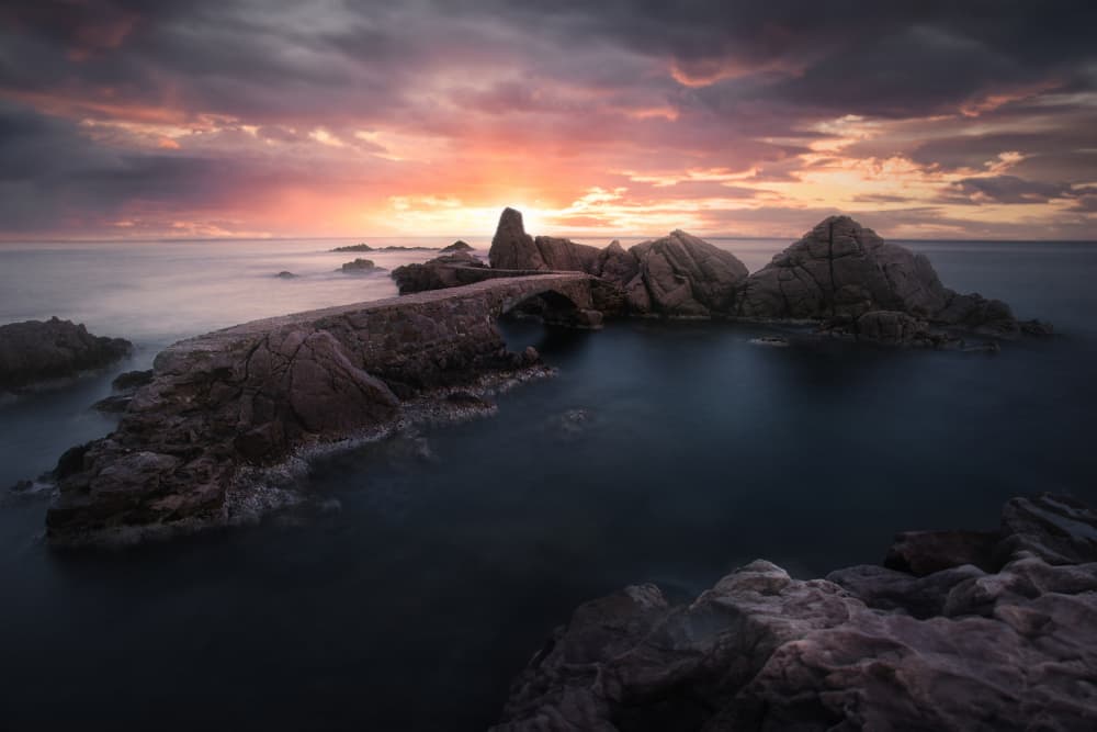 Dramatic Stone Bridge Sunset by Tomás Hueso Marco — canvas wall art