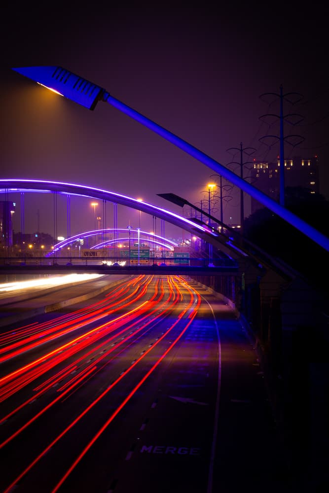Urban Night Light Trails by Olivier Catherine — canvas wall art
