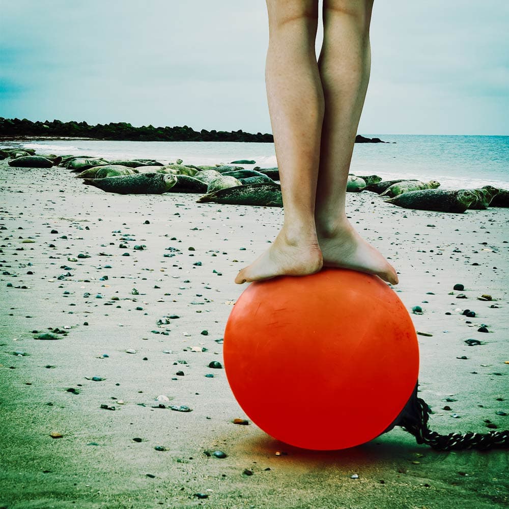 Barefoot On Orange Buoy by ambra — canvas wall art