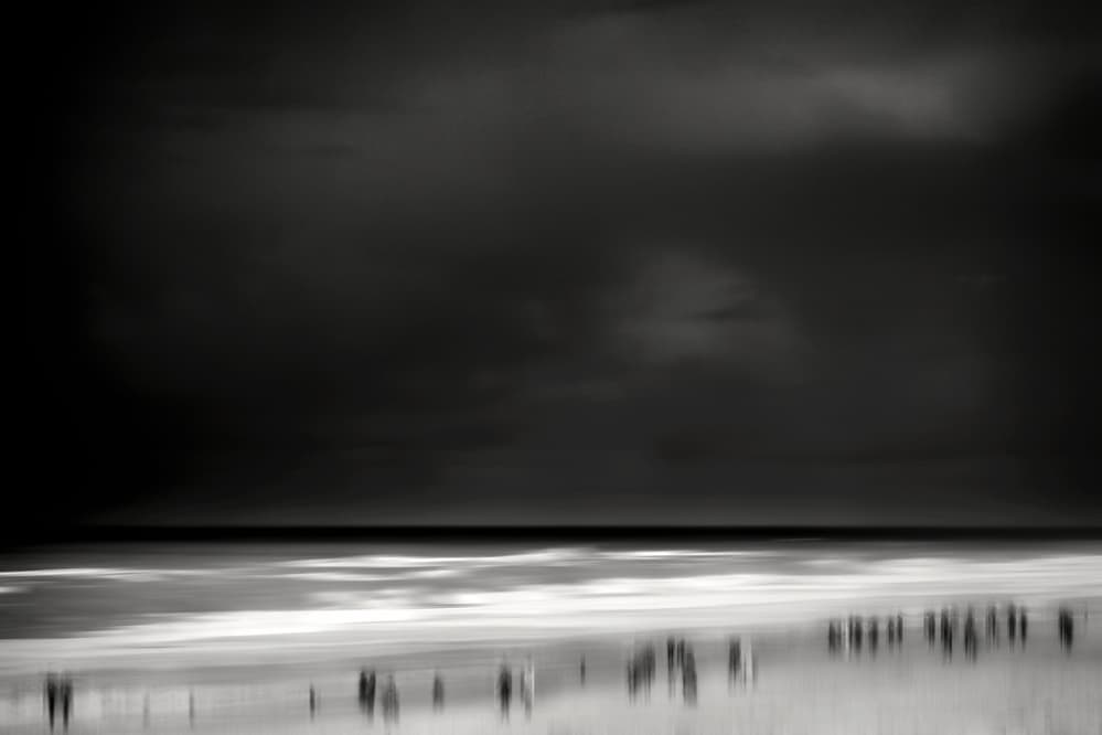 Dark Beach Figures by Bruno Flour — canvas wall art