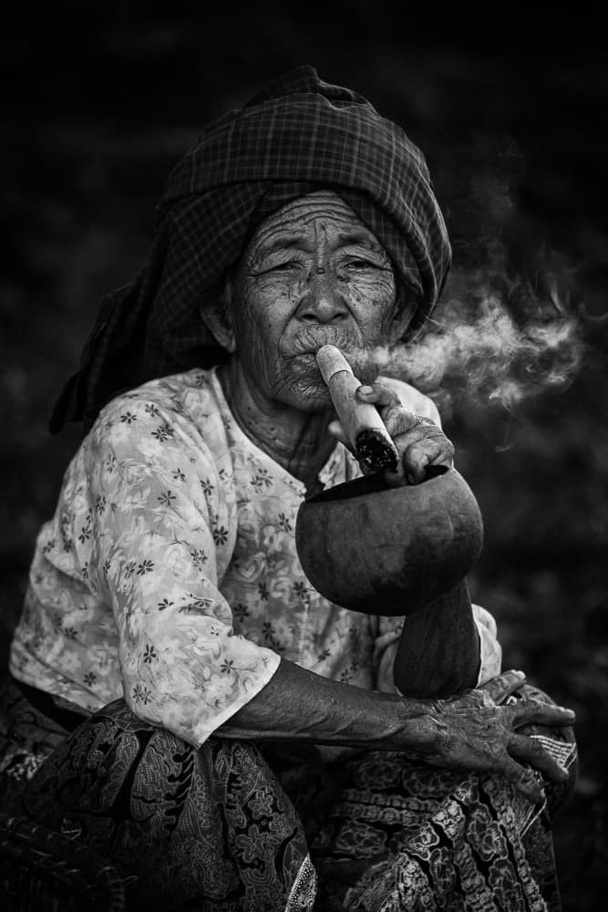 Elderly Woman Smoking Pipe by António Carreira — canvas wall art