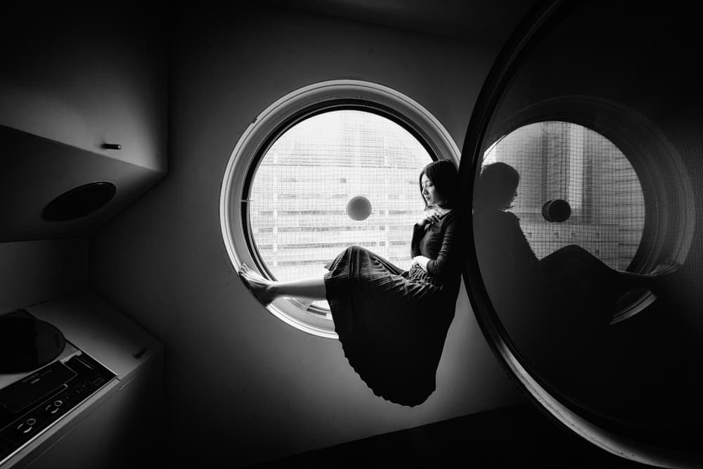 Thoughtful Woman Window Reflection by Nobu Ishijima — canvas wall art