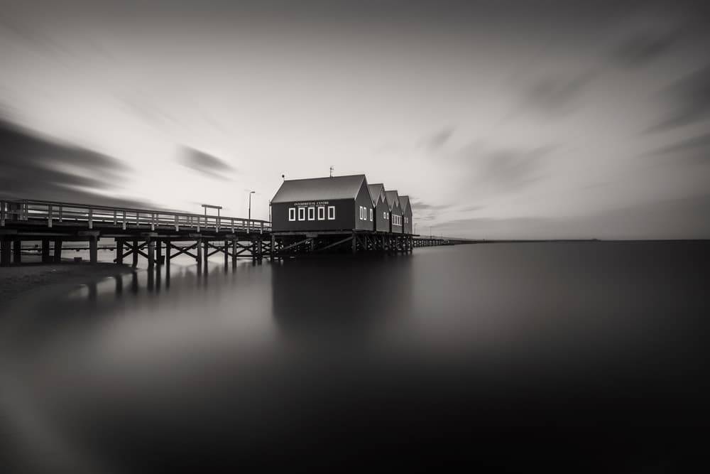 Serene Coastal Boathouses by Despird Zhang — canvas wall art