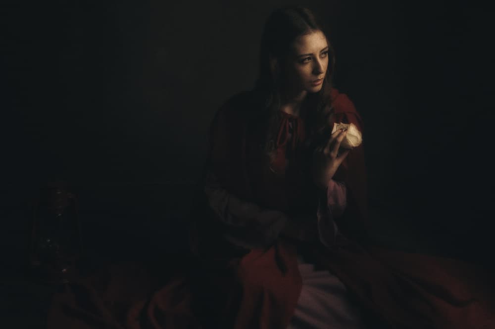 Thoughtful Woman in Red by Hari Sulistiawan — canvas wall art