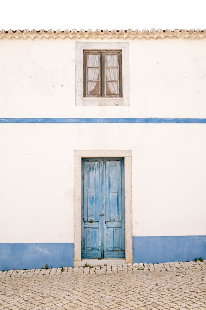 Ericeira Blue Door by Raisa Zwart — canvas wall art