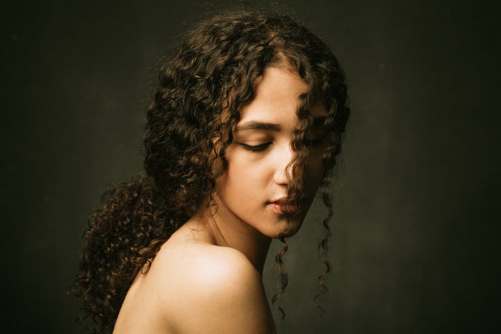 Pensive Young Woman by Mehdi Mokhtari — canvas wall art