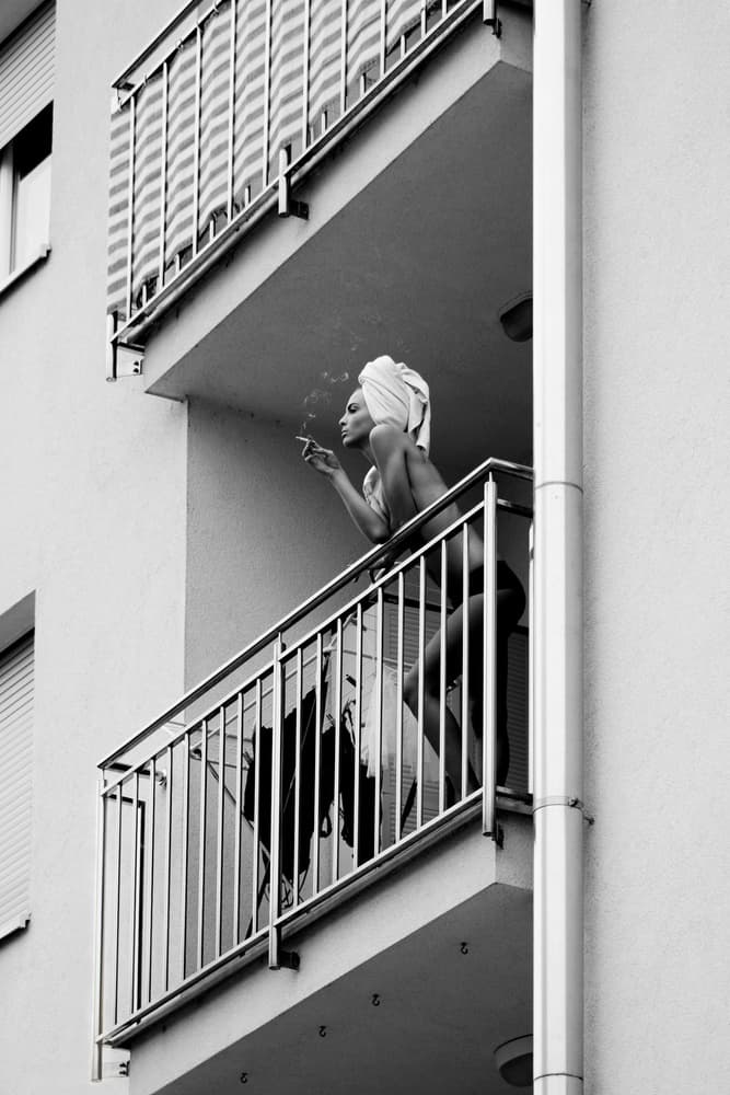 Woman Balcony Smoke by Lorna Kijurko — canvas wall art