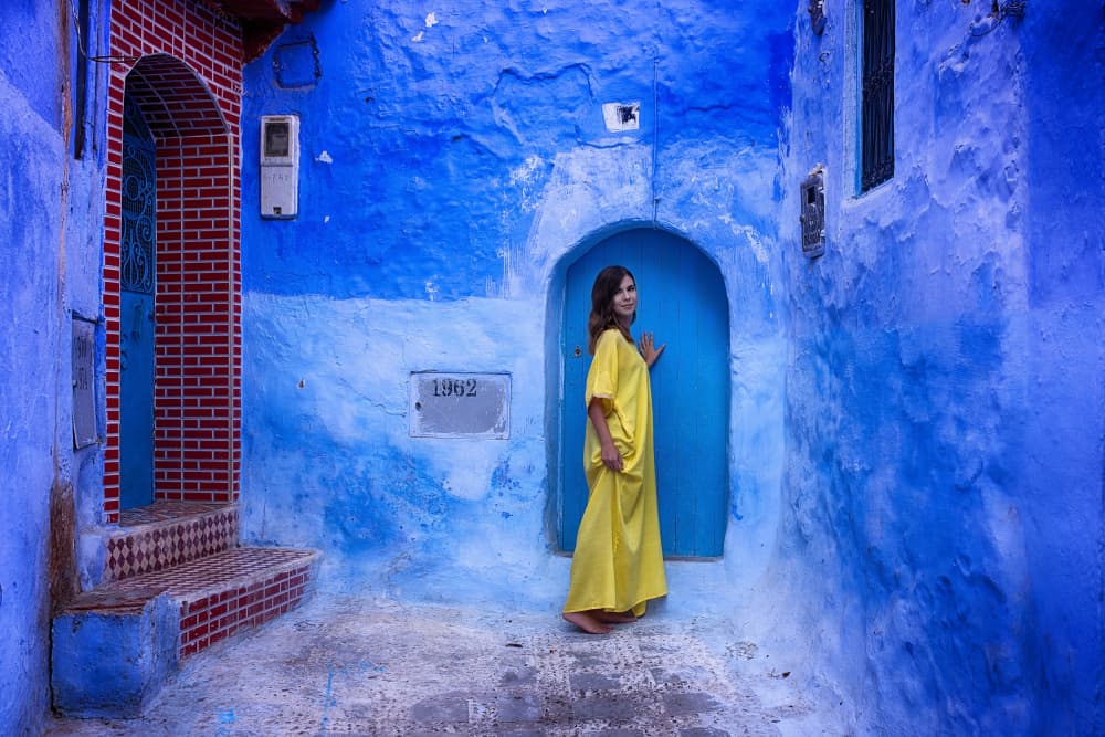 Yellow Dress Blue City by Bogdan Negoita — canvas wall art