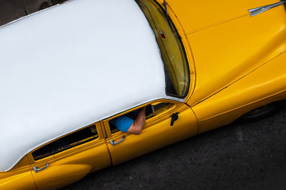 Sunny Yellow Vintage Car by Ali Khataw — canvas wall art